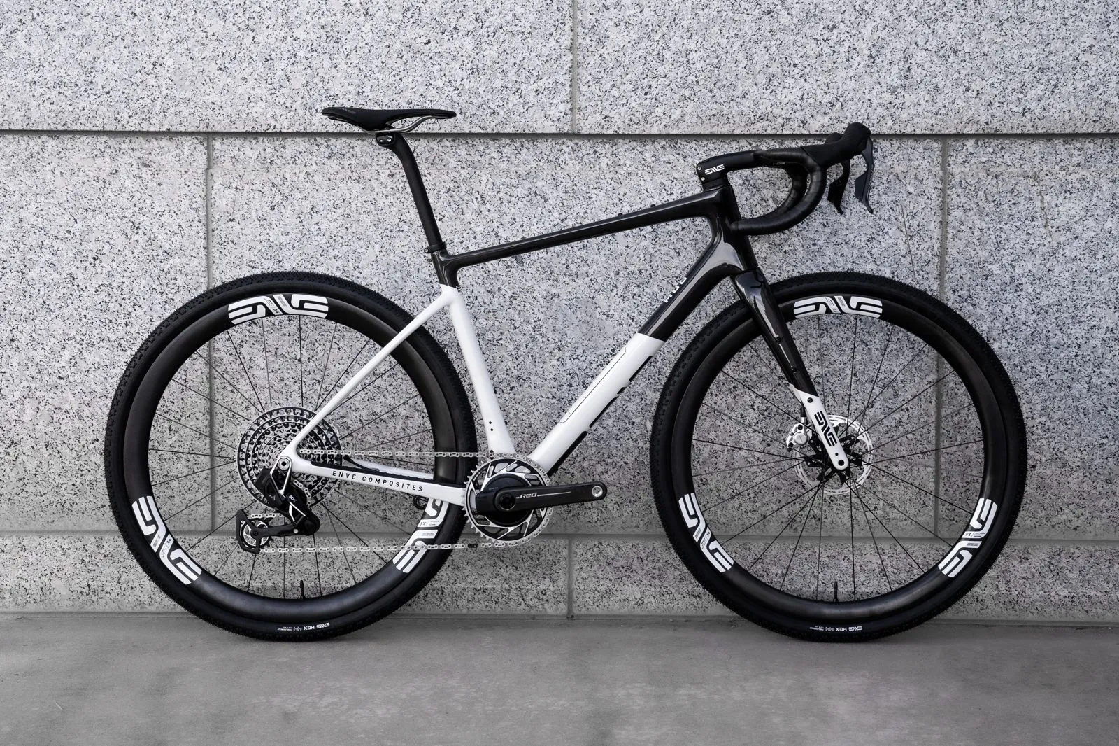 White and black ENVE MOG gravel bike leaning against a granite wall