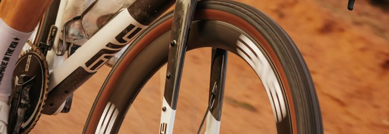 ENVE carbon fork and wheel with a tan-wall tire on red dirt